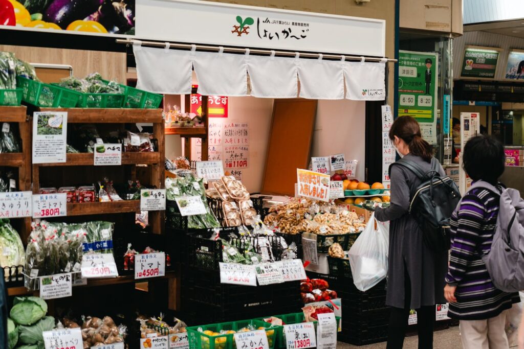 a girl buying grocery at market in japan